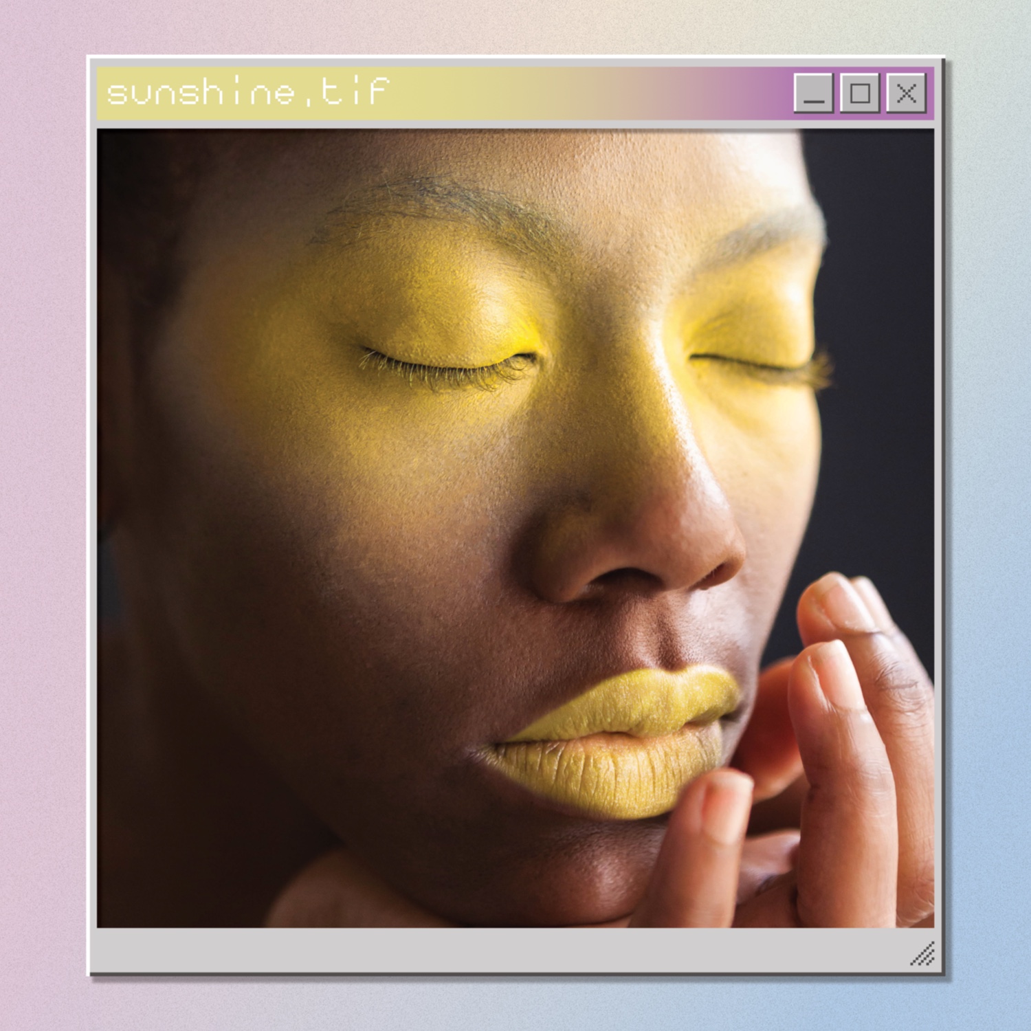 Portrait of a dark skinned model with glittery yellow lipstick and yellow eye makeup, in a windows 95 style frame